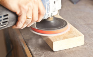 an orbital machine sanding a wood